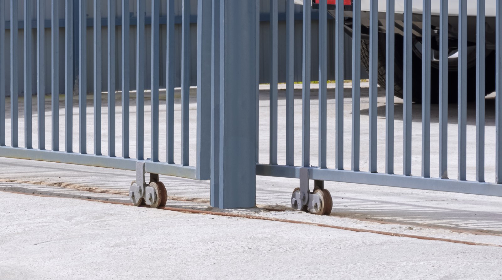 side view of sliding metal fence gate in front of 2026 03 24 00 45 54 utc