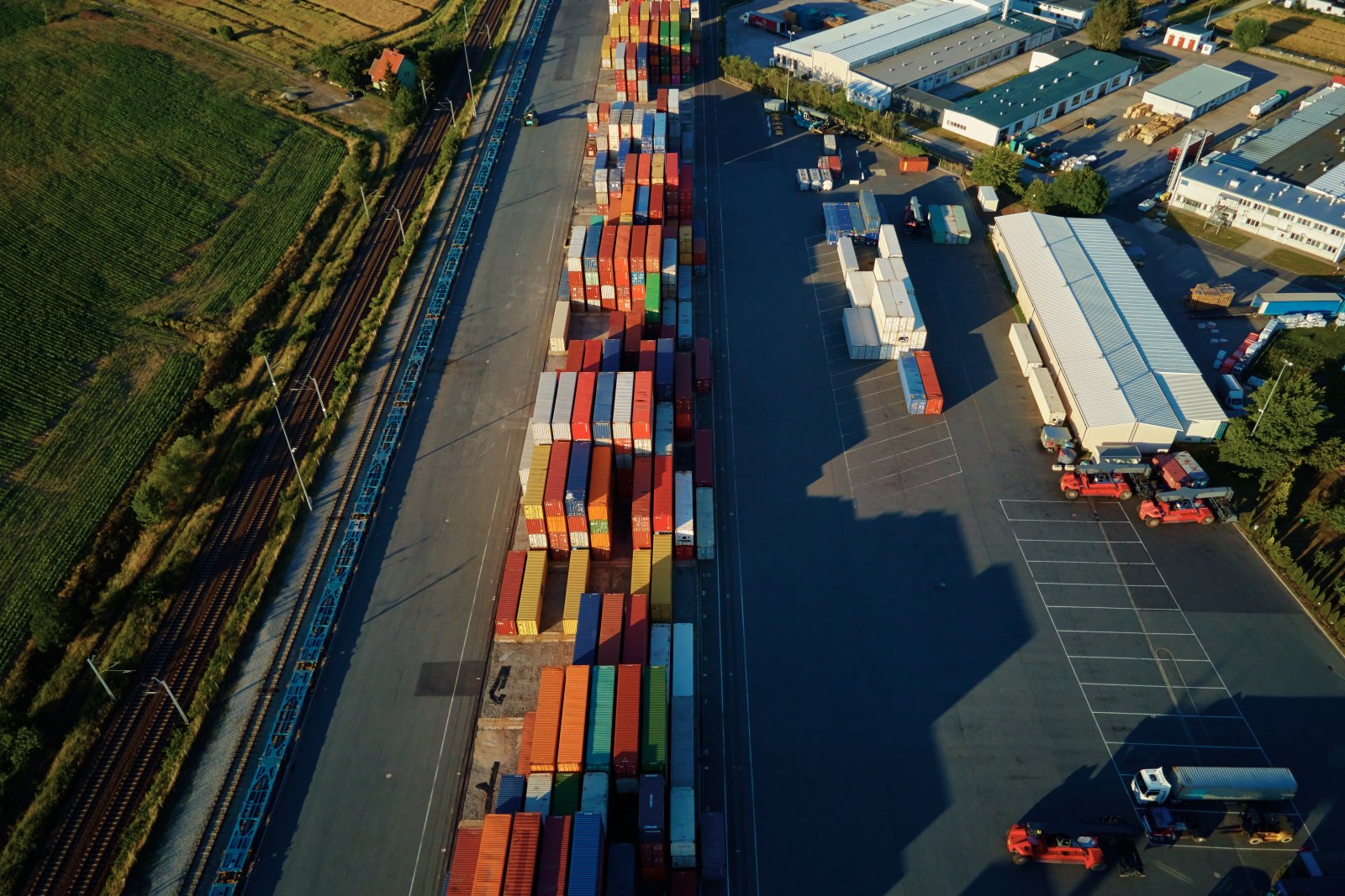 shipping containers stacked high at a transfer sta 2026 03 23 22 27 05 utc